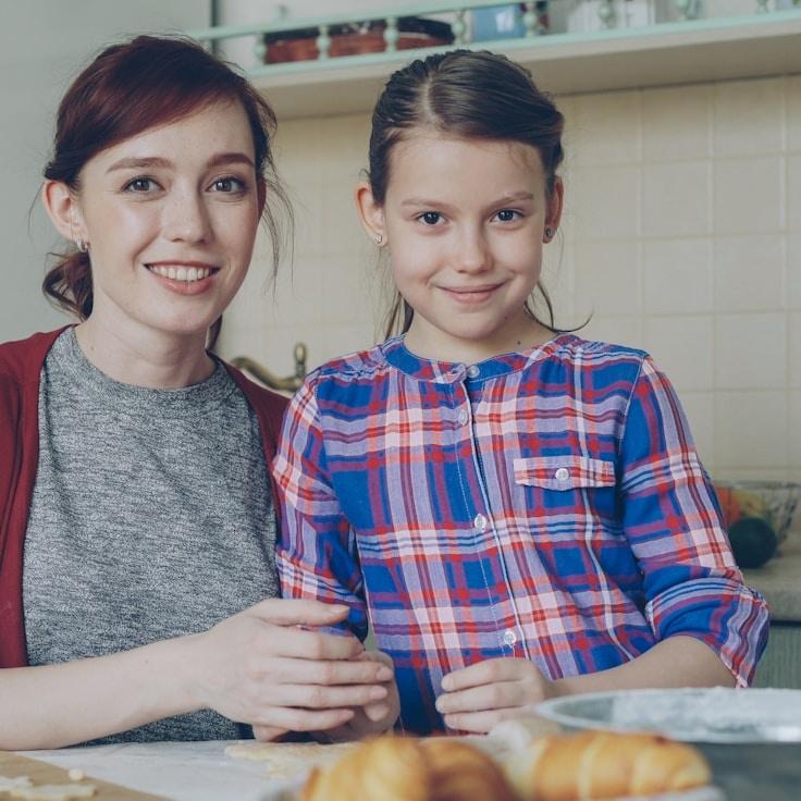 Maya Singh, Lead Design Curator at PeacefulRiverCollective, reviewing corporate floral arrangements